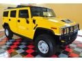 Yellow 2004 Hummer H2 SUV