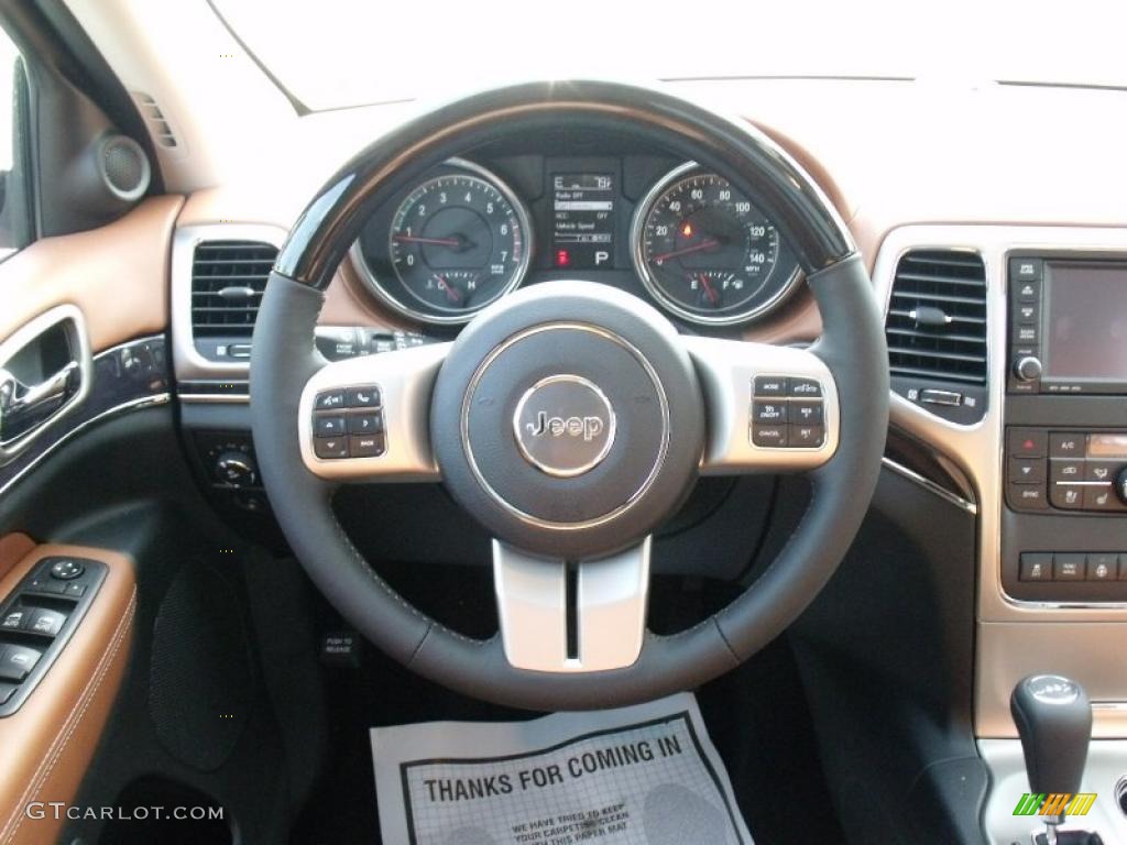 2011 Jeep Grand Cherokee Overland New Saddle/Black Steering Wheel Photo #49826361
