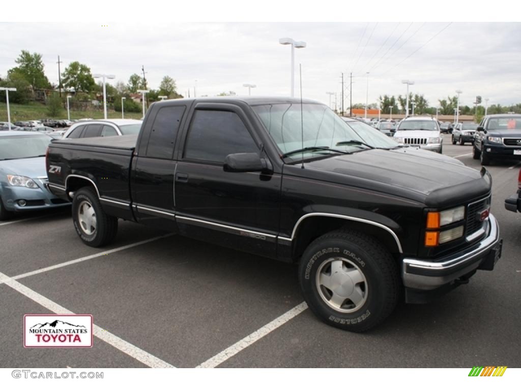 1999 Sierra 1500 SLE Extended Cab 4x4 - Onyx Black / Graphite photo #1