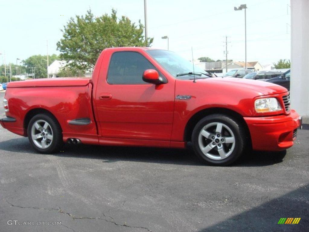 Bright Red 2001 Ford F150 SVT Lightning Exterior Photo #49889309