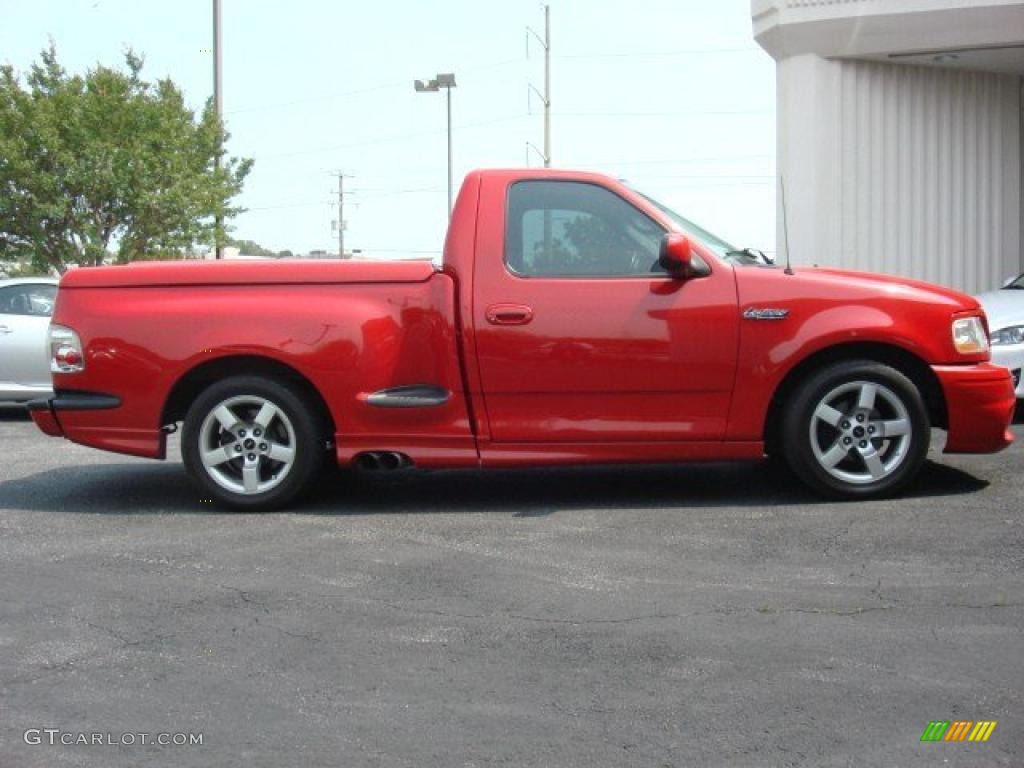 Bright Red 2001 Ford F150 SVT Lightning Exterior Photo #49889324