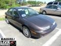 1999 Brown Saturn S Series SL2 Sedan #50037074