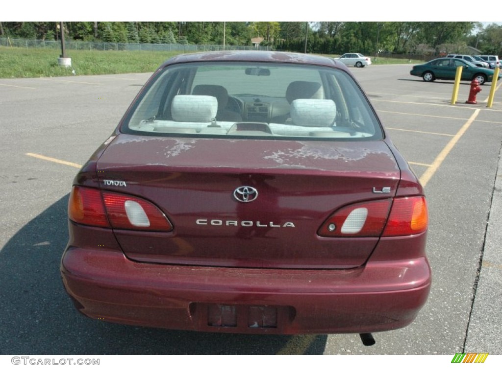 1998 Corolla LE - Ruby Red Pearl Metallic / Beige photo #5
