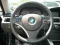 Black 2011 BMW 3 Series 335i xDrive Coupe Steering Wheel