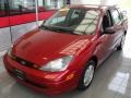 2003 Sangria Red Metallic Ford Focus LX Sedan  photo #1