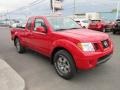 Front 3/4 View of 2011 Frontier Pro-4X King Cab 4x4