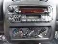 2001 Chrysler Sebring Black/Beige Interior Controls Photo