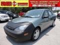 2004 Light Tundra Metallic Ford Focus SE Sedan  photo #1