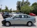 2004 Light Tundra Metallic Ford Focus SE Sedan  photo #2