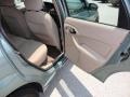 2004 Light Tundra Metallic Ford Focus SE Sedan  photo #13