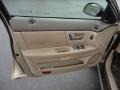 Medium Parchment 2000 Ford Taurus SEL Door Panel