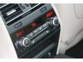 Oyster/Black Controls Photo for 2012 BMW 7 Series #50878711