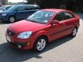 Sunset Orange 2009 Kia Rio SX Sedan