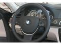 Oyster/Black Steering Wheel Photo for 2012 BMW 7 Series #51095588
