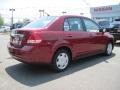 2009 Red Brick Nissan Versa 1.8 S Sedan  photo #3