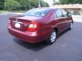 2004 Salsa Red Pearl Toyota Camry LE  photo #24