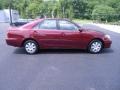2004 Salsa Red Pearl Toyota Camry LE  photo #25