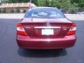 2004 Salsa Red Pearl Toyota Camry LE  photo #27