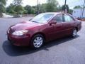 2004 Salsa Red Pearl Toyota Camry LE  photo #28