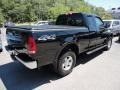 2002 Black Ford F150 XLT SuperCab 4x4  photo #5