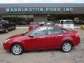 2010 Sangria Red Metallic Ford Focus SEL Sedan  photo #1