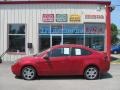 2009 Sangria Red Metallic Ford Focus SE Coupe  photo #4