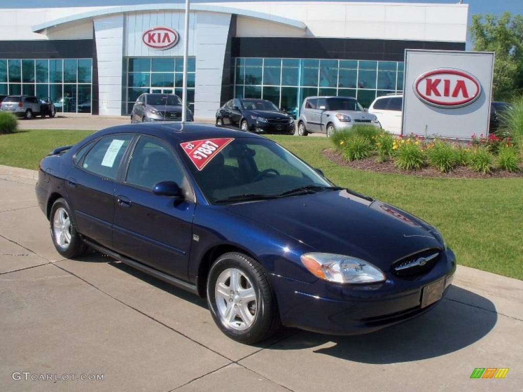 Medium Royal Blue Metallic Ford Taurus