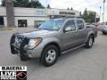 2006 Granite Metallic Nissan Frontier LE Crew Cab 4x4  photo #1