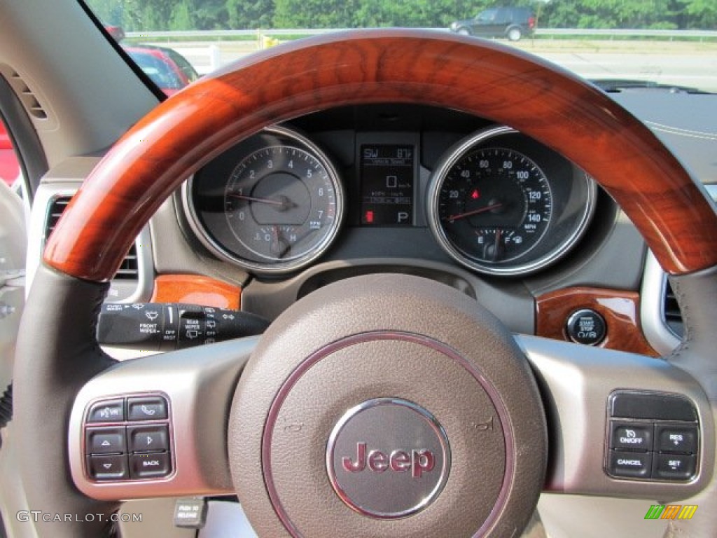 2011 Jeep Grand Cherokee Overland 4x4 Dark Frost Beige/Light Frost Beige Steering Wheel Photo #52070161