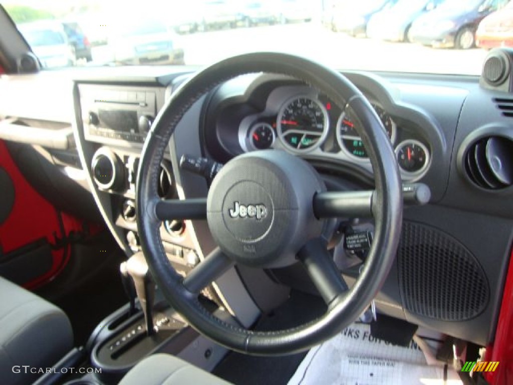 2010 Jeep Wrangler Unlimited Sport 4x4 Right Hand Drive Dark Slate Gray/Medium Slate Gray Steering Wheel Photo #52102490