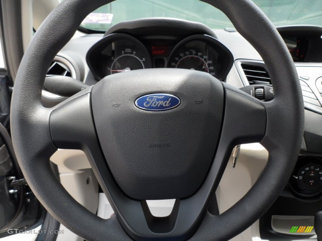 2011 Ford Fiesta S Sedan Light Stone/Charcoal Black Cloth Steering Wheel Photo #52128073