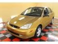 2001 Jackpot Gold Metallic Ford Focus SE Sedan  photo #2