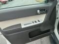 Black 2009 Mercury Mariner V6 Premier 4WD Door Panel