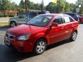 2010 Tropical Red Kia Rio LX Sedan  photo #1