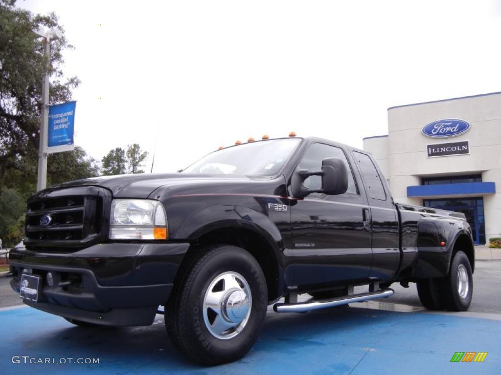 2002 F350 Super Duty XLT Crew Cab 4x4 Dually - Black / Black photo #1