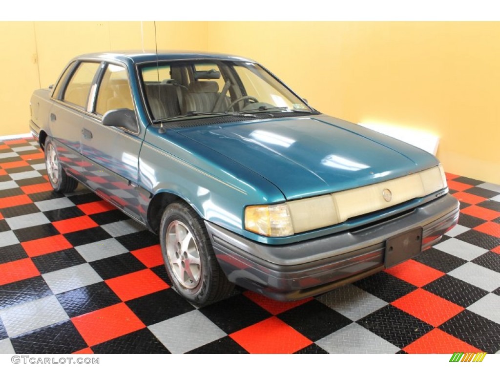 1993 Topaz GS Sedan - Cayman Green Metallic / Beige photo #1