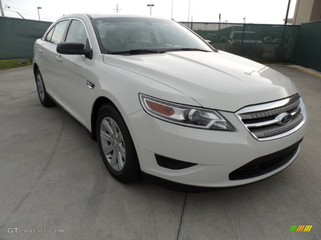 White Suede Ford Taurus