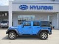 2010 Surf Blue Pearl Jeep Wrangler Unlimited Islander Edition 4x4  photo #3