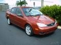 2005 Blazing Copper Metallic Ford Focus ZX4 SES Sedan  photo #2