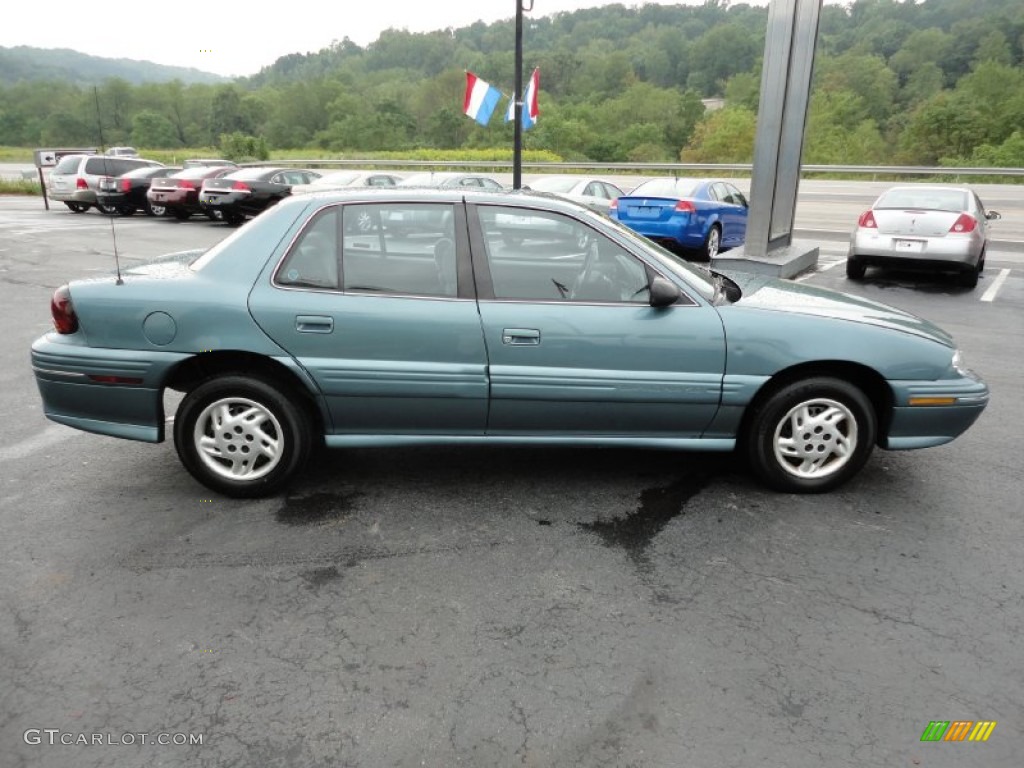 Light Jade Gray Metallic 1997 Pontiac Grand Am SE Sedan Exterior Photo #53907448