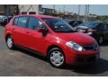 Red Alert 2009 Nissan Versa 1.8 S Hatchback Exterior