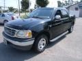 2002 Black Ford F150 XLT SuperCrew  photo #1