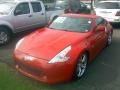 2009 Solid Red Nissan 370Z Touring Coupe  photo #1