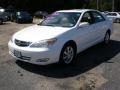 2004 Crystal White Toyota Camry LE  photo #1
