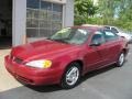 2004 Sport Red Metallic Pontiac Grand Am SE Sedan  photo #1