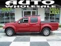 Red Brick 2010 Nissan Frontier LE Crew Cab