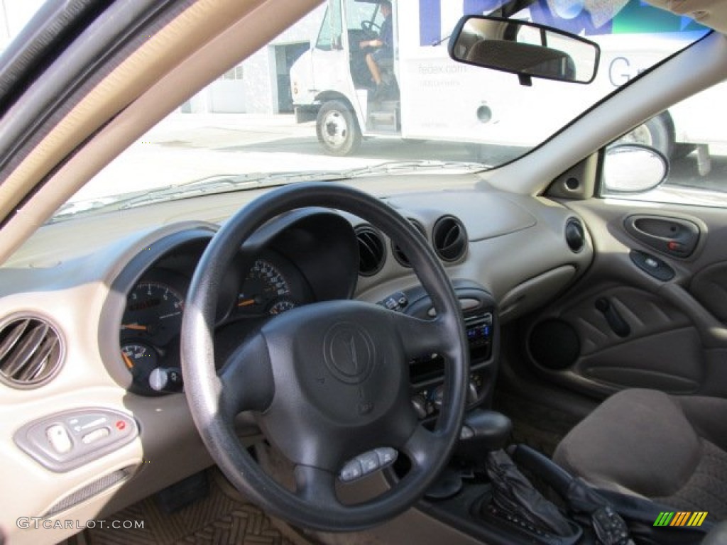 2002 Grand Am SE Sedan - Dark Bronzemist Metallic / Dark Taupe photo #13