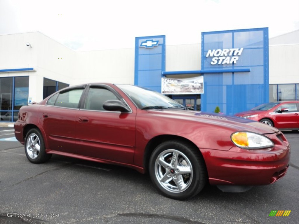 2003 Grand Am SE Sedan - Redfire Metallic / Dark Taupe photo #1