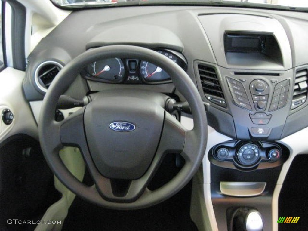 2012 Ford Fiesta S Sedan Light Stone/Charcoal Black Steering Wheel Photo #54535609
