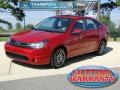 2010 Sangria Red Metallic Ford Focus SES Sedan  photo #1